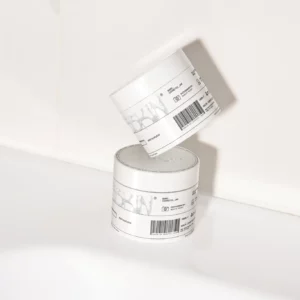 Set of cosmetic jars on a bathroom sink. Packaging PSD file. Cream jar mockup. Skin care mockup.