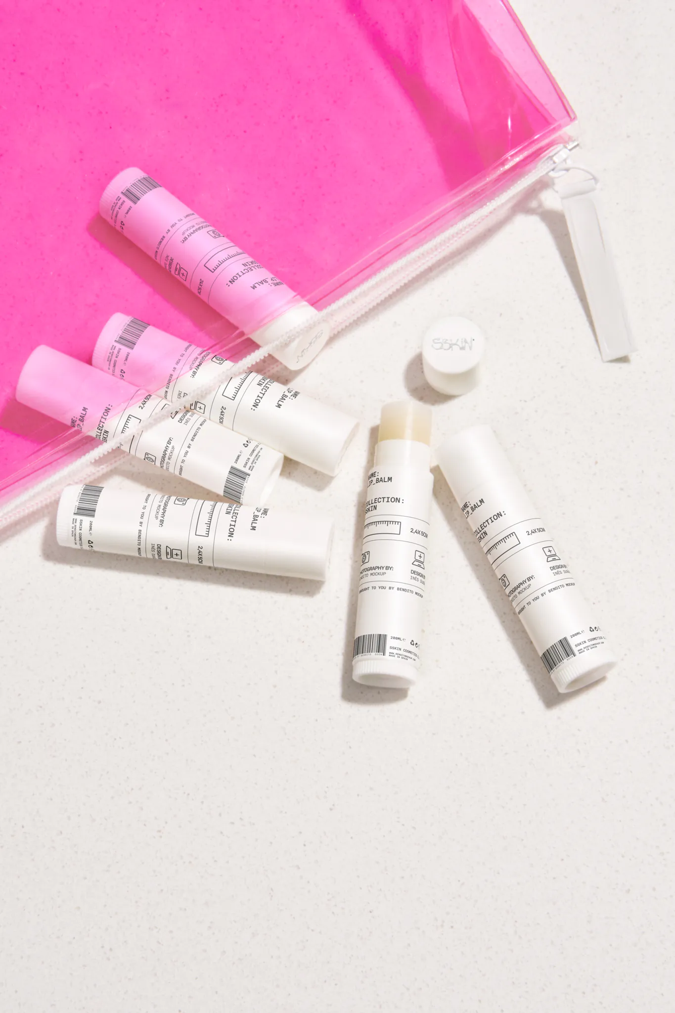 Set of lip balms mockup inside a pink transparent bag. Lip balm mockup. Cosmetic PSD file. High-quality lip balm mockup.