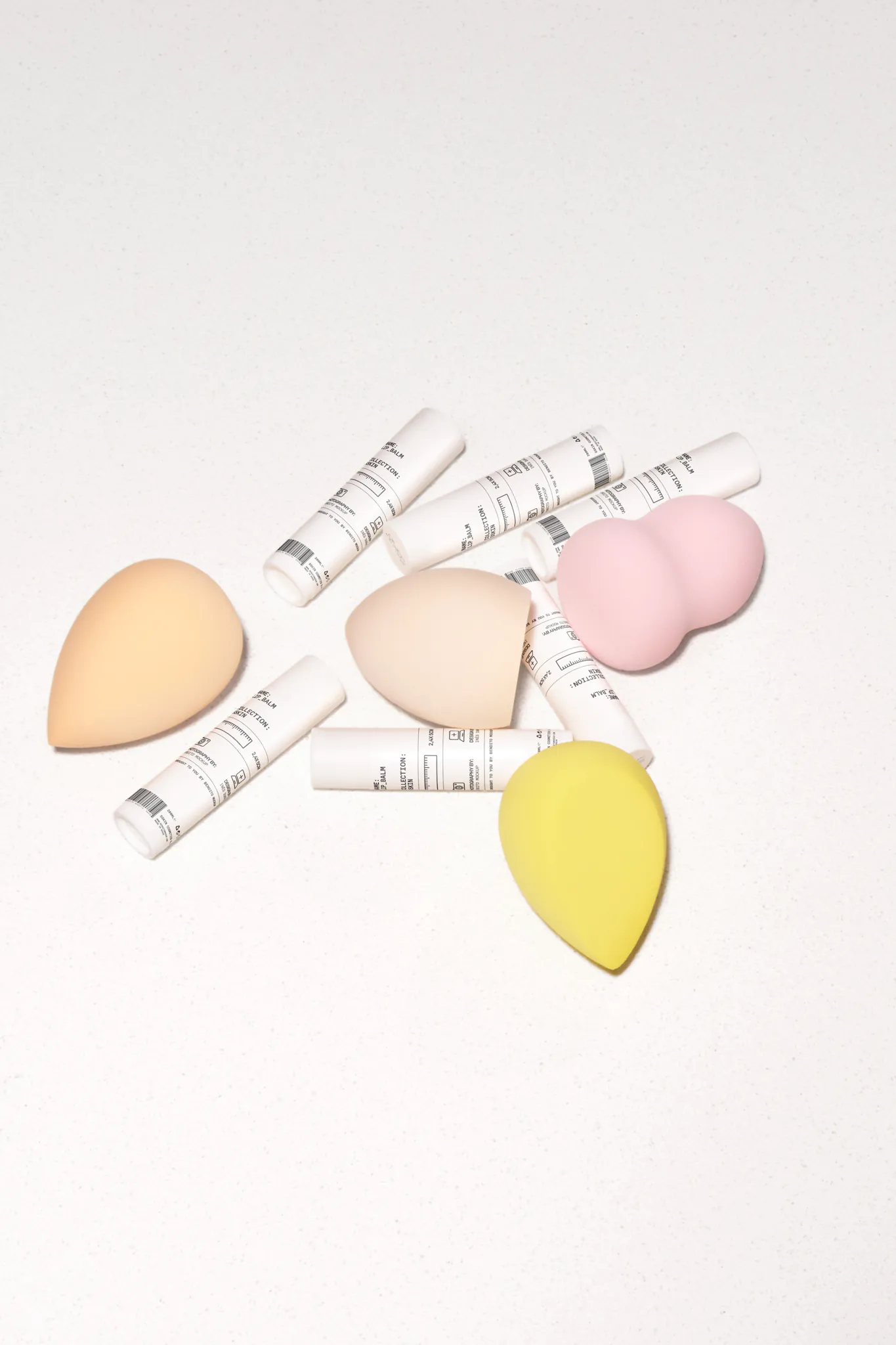 Set of lip balms mockup over a white surface. Lip balm mockup. Cosmetic PSD file. High-quality lip balm mockup.