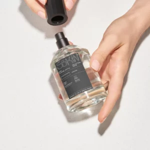 Woman opening a perfume bottle mockup. Perfume bottle mockup. Perfume bottle PSD file. High-quality packaging mockup.