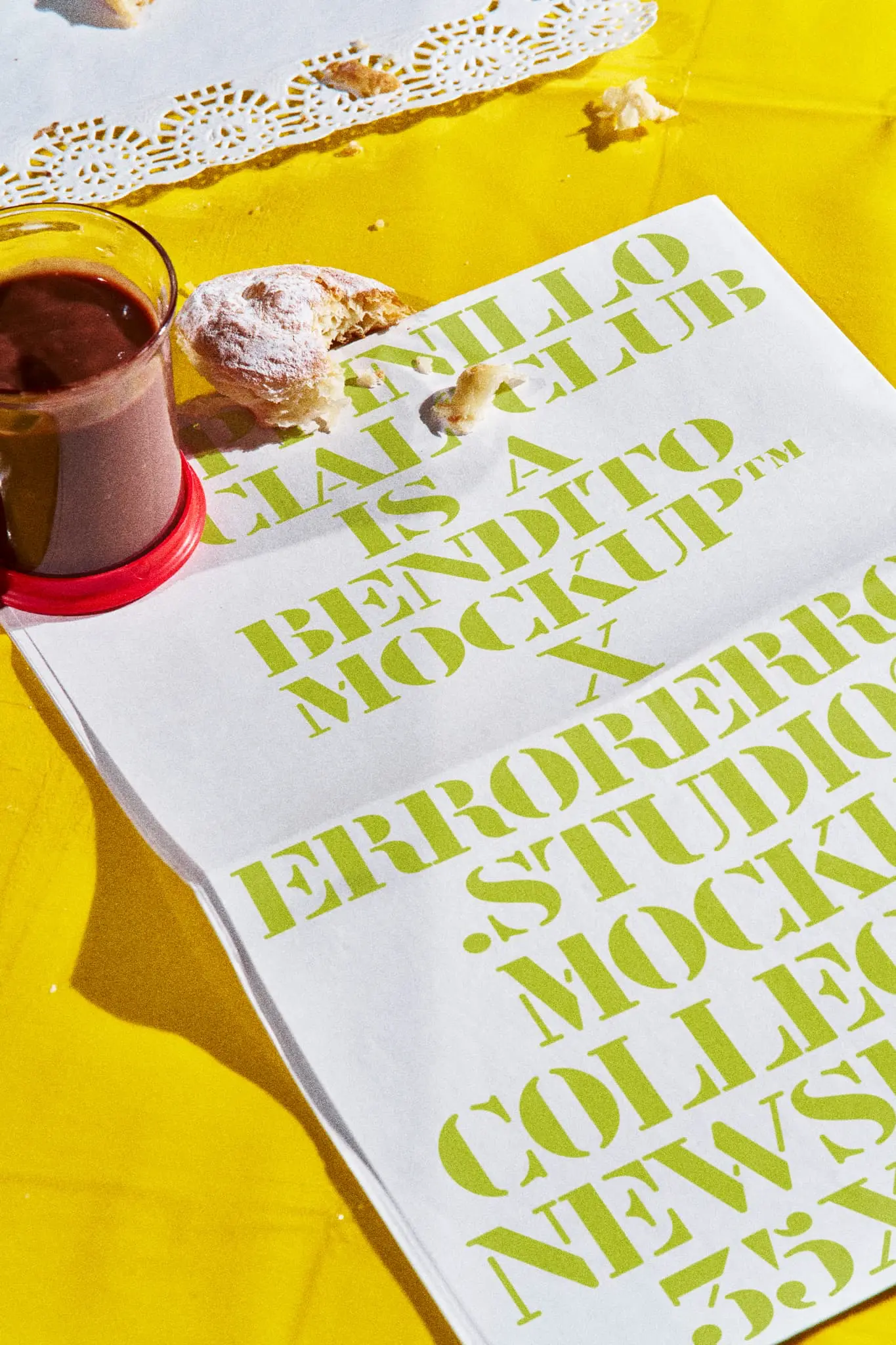 Newspaper mockup on a table in a burger restaurant with a yellow tablecloth and a cup of chocolate on top of it. Print mockup. Newspaper PSD file. Takeaway mockup. Fast food mockup. High-quality mockup.