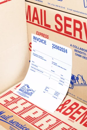 Mockup of blank framed poster displayed on a stovetop in a professional kitchen. Ideal for culinary branding concepts.