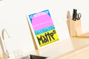 Close up of a high quality frame mockup in a kitchen setting on a wooden countertop. Premium poster mockup to showcase your design in a real life interior environment. Aesthetic print mockup fully editable in Adobe Photoshop.