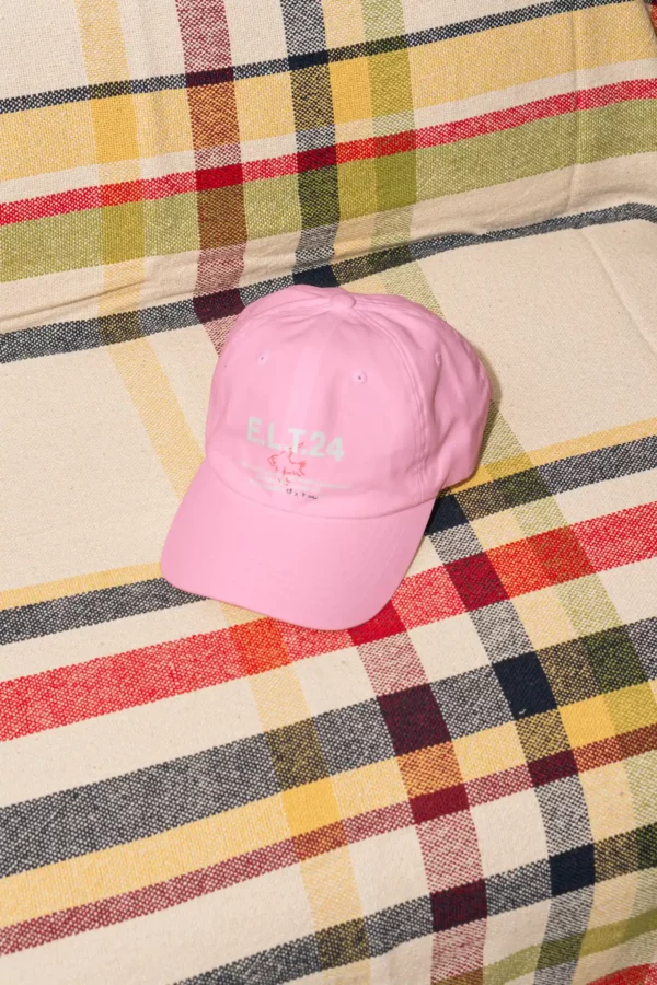 Color Version — 'Every Little Thing' 24 cap mockup on blanket, ideal for customizable accessory branding.