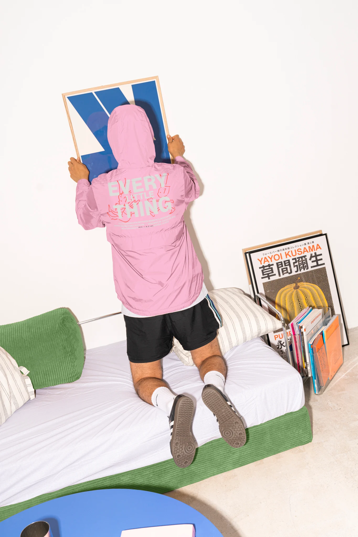 Color Version — 'Every Little Thing' orange hoodie mockup, ideal for sportswear branding.