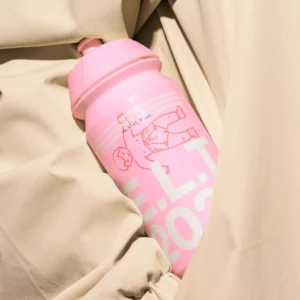 Color Version — Sports bottle 'Every Little Thing' inside beige coat, ideal for outdoor product branding.