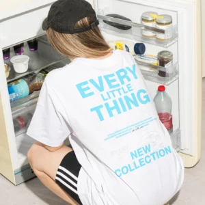 T-shirt 'Every Little Thing' in front of an open fridge