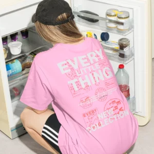 Color Version — T-shirt 'Every Little Thing' in front of an open fridge, ideal for custom branding designs.