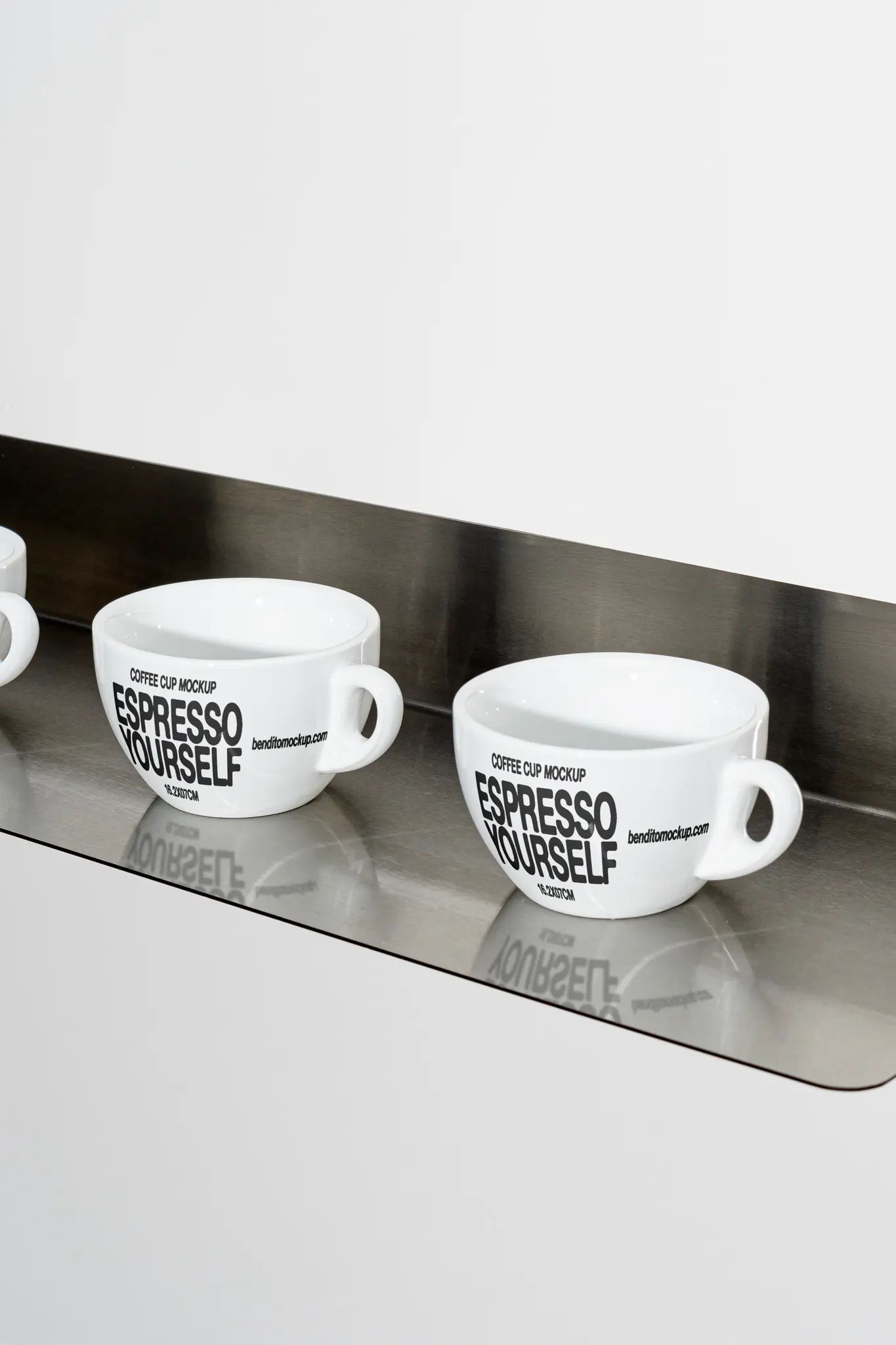 Espresso Yourself coffee cups arranged on a metal shelf