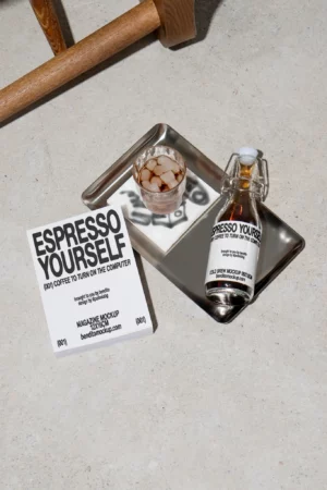 Espresso Yourself cold brew bottle with a glass of iced coffee on a tray