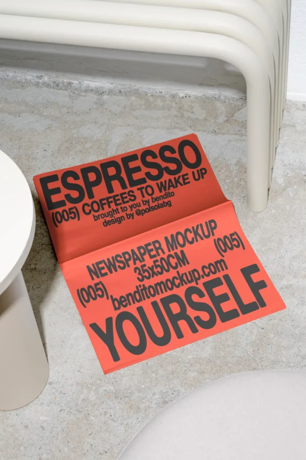 Color-Version: Folded Espresso Yourself newspaper mockup on a concrete floor