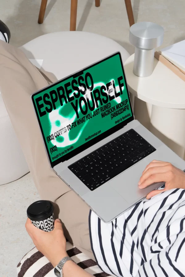 Color Version: Person using a MacBook displaying Espresso Yourself branding