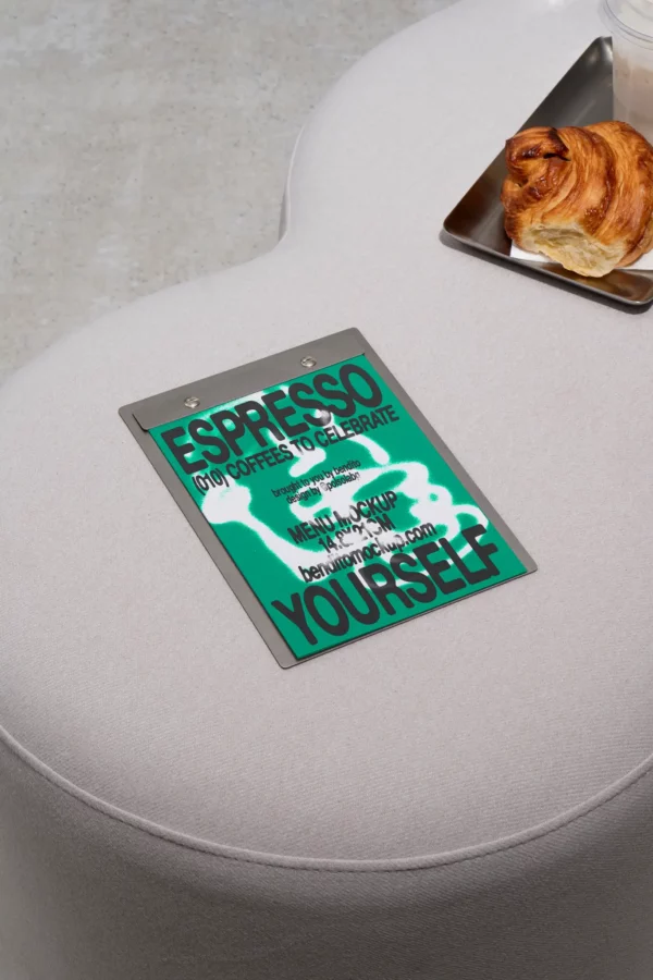 Color Version: Espresso Yourself menu on a table with a pastry and coffee