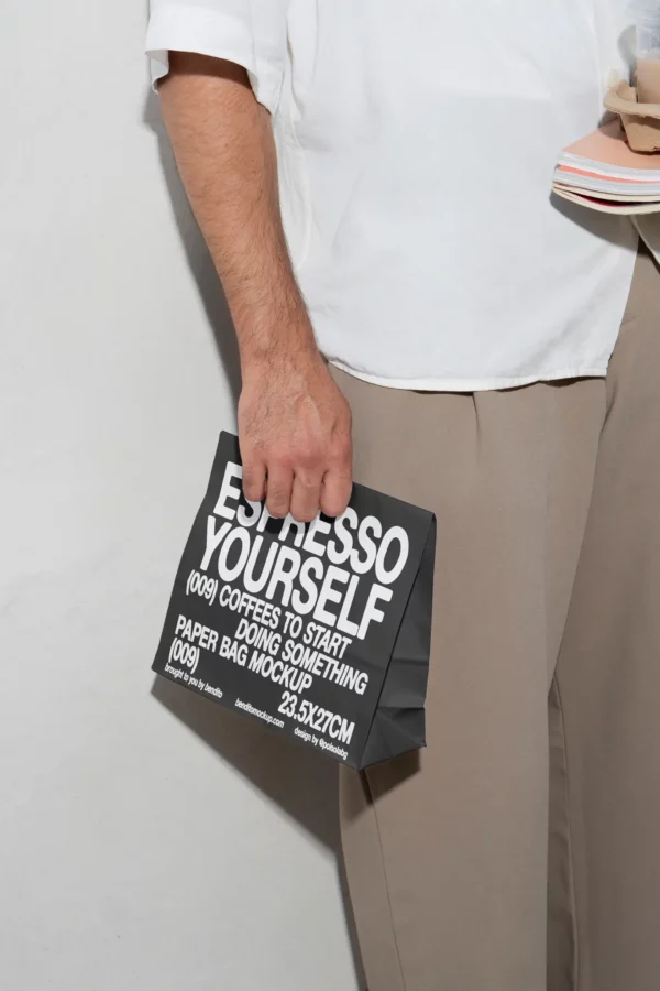 Color Version: Person holding an Espresso Yourself paper bag mockup