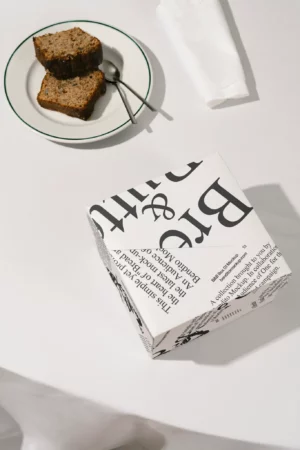 Box mockup from the Bread & Butter collection on a table with slices of bread.