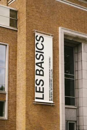 Tall exterior banner on a modern brick facade