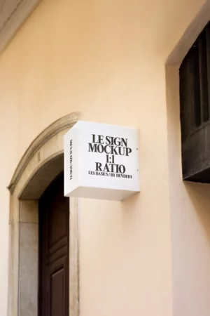 A realistic mockup of a rectangular wooden sign with a smooth texture featuring a blank surface for customization. The sign is positioned against a light gray background with soft shadows and natural lighting enhancing its three-dimensional appearance.