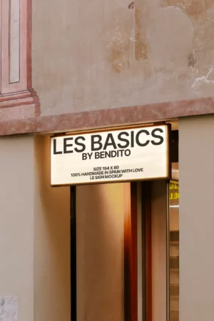 A mockup of a rectangular lightbox sign on a plain wall with a soft shadow cast to the right.