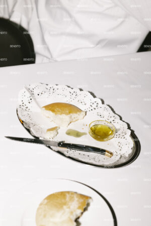 Bread and olive oil on a decorative plate.