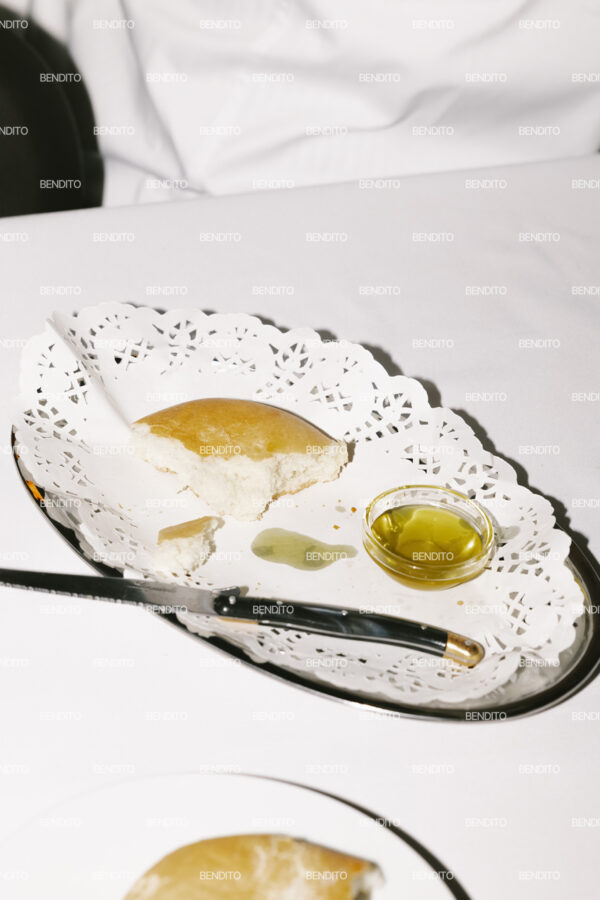 Close-up of bread and olive oil on a decorative.