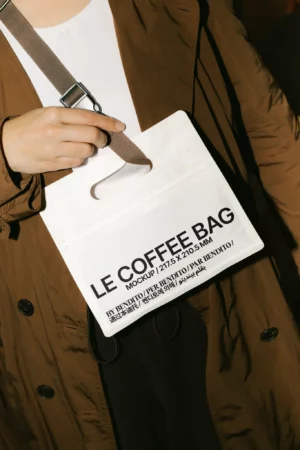 A brown paper coffee bag with a black label standing upright on a plain background