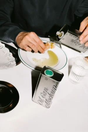 Mockup of a metal oil can on a table. Perfect for showcasing olive oil or food-related branding