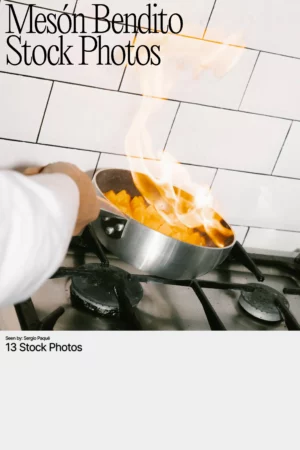 Mockup of a hand cooking diced vegetables in a flaming pan over a gas stove, against a tiled kitchen wall.