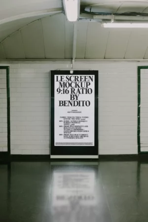 A person holding a laptop with a blank screen outdoors