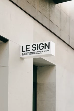 Laptop displaying a blank white screen with a stylus resting on the keyboard against a plain background