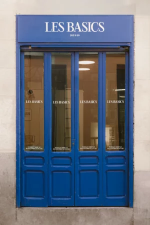 A clear bottle with a pump dispenser standing on a white surface