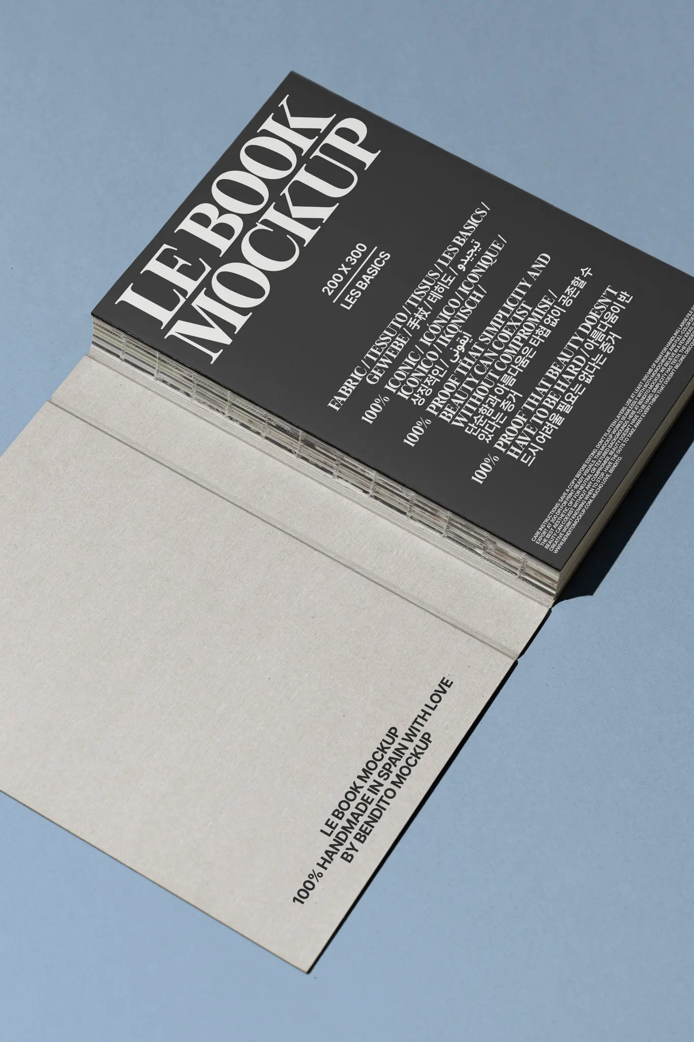 Hover image: A closed hardbound book with a light grey cover and a visible spine
