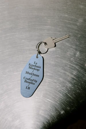 A small rectangular keychain with a metal ring attached