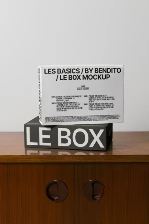 White product box mockup on wooden cabinet with iconic multilingual branding.