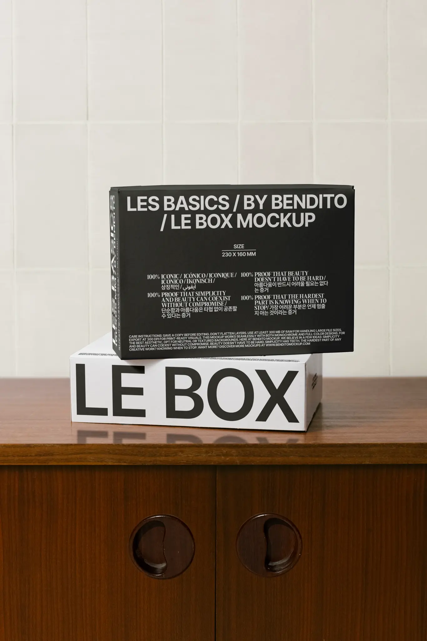 Hover image: White product box mockup on wooden cabinet with iconic multilingual branding.