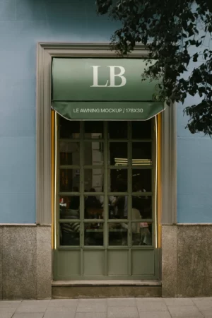 Mockup of green awning on store facade with branding initials ‘LB’.