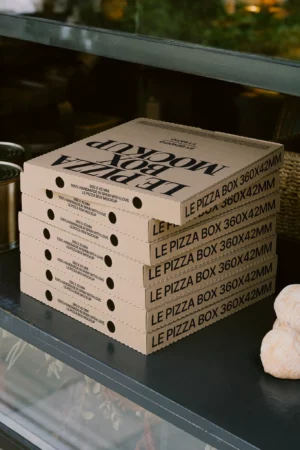 Stack of cardboard pizza box mockups in natural kraft color, labeled 360 x 42 mm, perfect for showcasing branding on food delivery packaging.