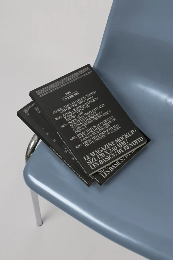 Magazine mockup stack on a modern chair. Vertical 170 × 240 mm format, perfect for editorial design and stylish print layouts.