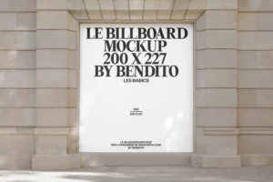 A large blank billboard mockup with bold black text reading “LE BILLBOARD MOCKUP 200 X 227 BY BENDITO” is displayed on a stone building facade. Sunlight casts soft shadows on the wall.